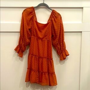 Altar'd State Terracotta Textured Dress with Bow on the Back.